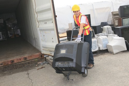 Professional waste clearance team handling construction debris